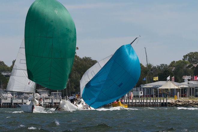 Evan Walker’s boat is hit by a gust as the kite is set. © Bernie Kaaks